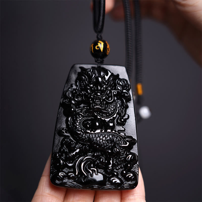 Black Obsidian Dragon Carved Pendant – Hand-held coiled dragon carving with gold Om bead, statement