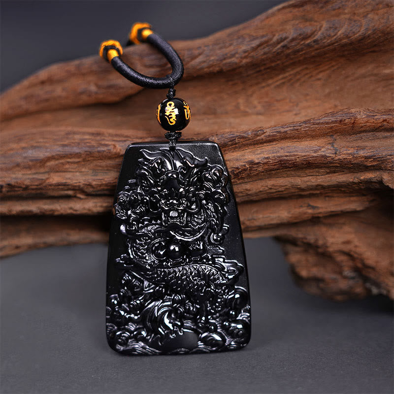 Black Obsidian Dragon Carved Pendant – Dragon relief with gold fortune bead on braided cord, masculine