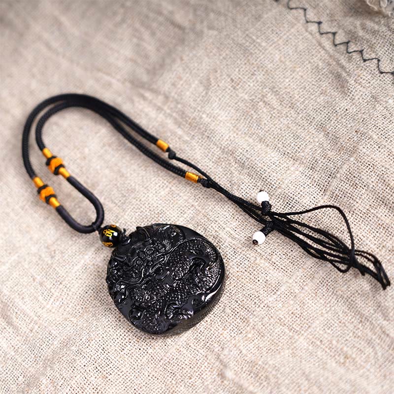 Black Obsidian Round Dragon Pendant – smooth uncarved oval pendant with mantra bead on blue-gray, zen