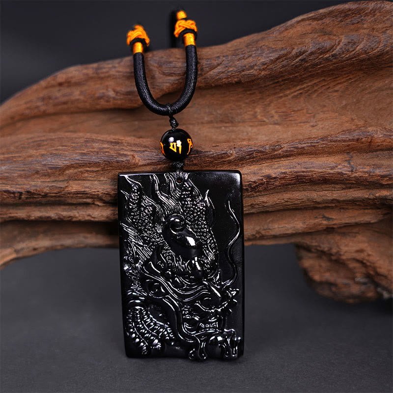 Black Obsidian Dragon Pendant – three-quarter dragon head relief on wood with blurred ceramic, heritage