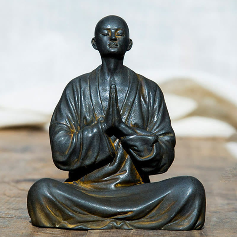 Meditating Praying Monk Statue Set – close-up of folded hands in prayer, mindfulness monk figurine