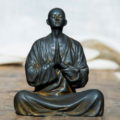 Meditating Praying Monk Statue Set – close-up of folded hands in prayer, mindfulness monk figurine