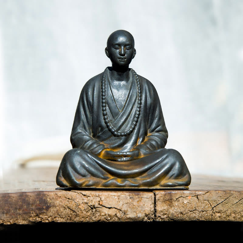 Meditating Praying Monk Statue Set – tabletop altar setting with candles, zen home shrine display