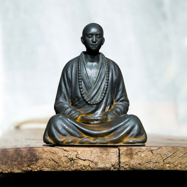 Meditating Praying Monk Statue Set – tabletop altar setting with candles, zen home shrine display