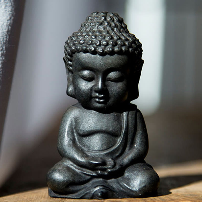 Small Sakyamuni Statue – bedside nightstand arrangement with candle and small figurine