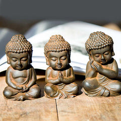 Small Sakyamuni Statue – front view of miniature deity with folded robe and calm face