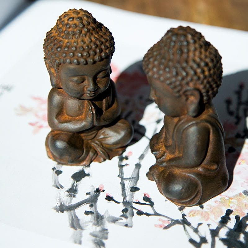 Small Sakyamuni Statue – three-quarter view showing gentle smile and earlobe elongation