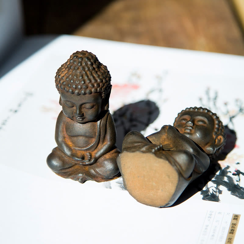 Small Sakyamuni Statue – overhead view showing symmetrical seated posture and robe fold