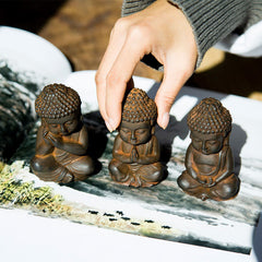 Small Sakyamuni Statue – side angle showing seated posture and compact lotus base form