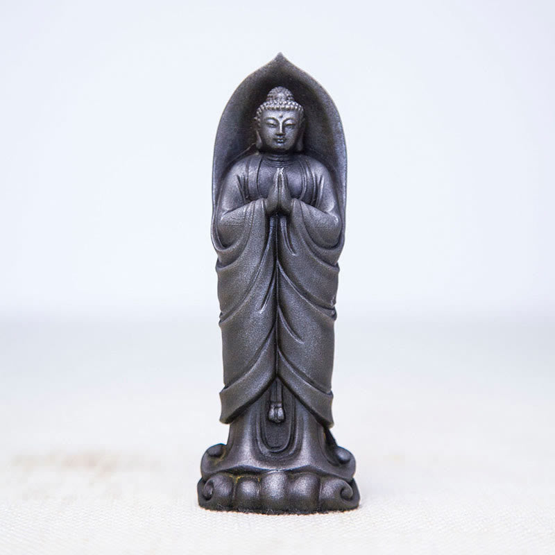 Sakyamuni Namaste Statue – statue on bookshelf between plants for modern home styling