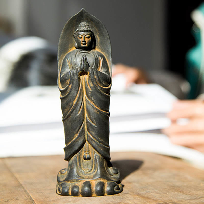 Sakyamuni Namaste Statue – full figure on wooden floor with soft natural room lighting