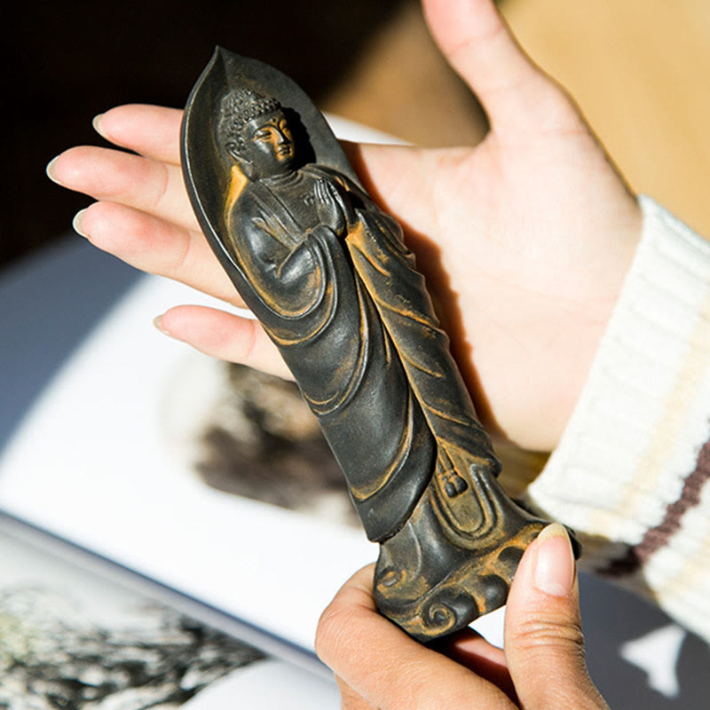 Sakyamuni Namaste Statue – close-up of face with gentle smile and elongated earlobes
