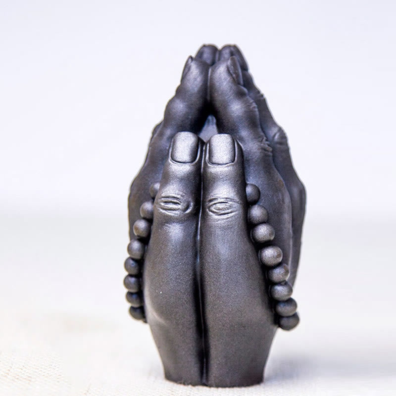 Buddha Hand Namaste Statue – pair of hand statues symmetric arrangement on altar cloth