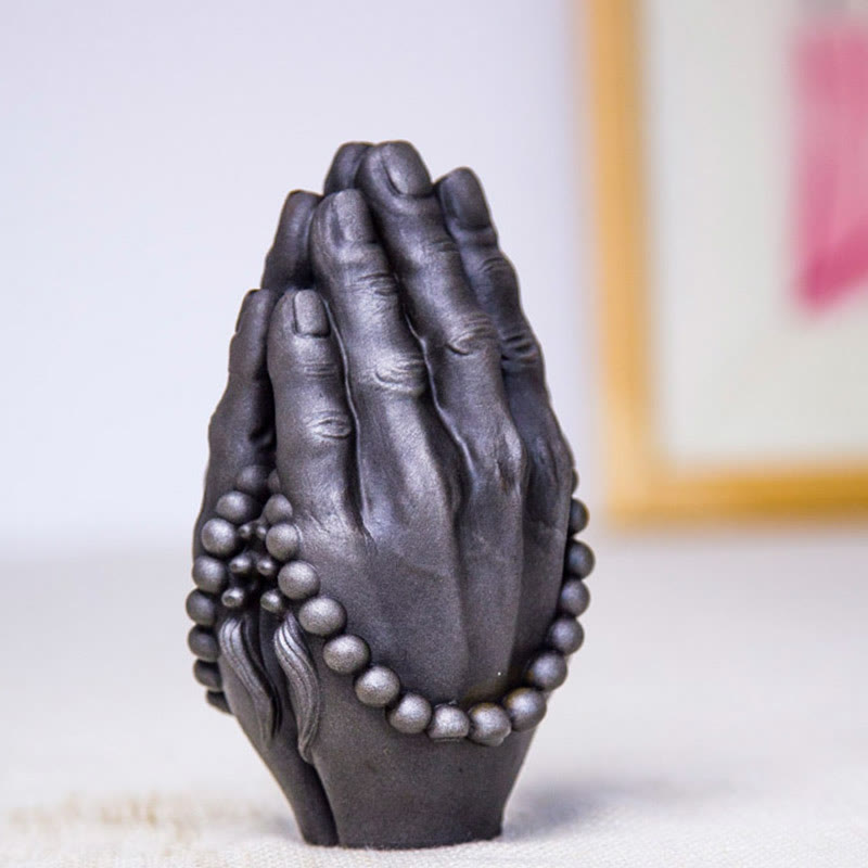 Buddha Hand Namaste Statue – zen meditation space with hand statue and bamboo plant