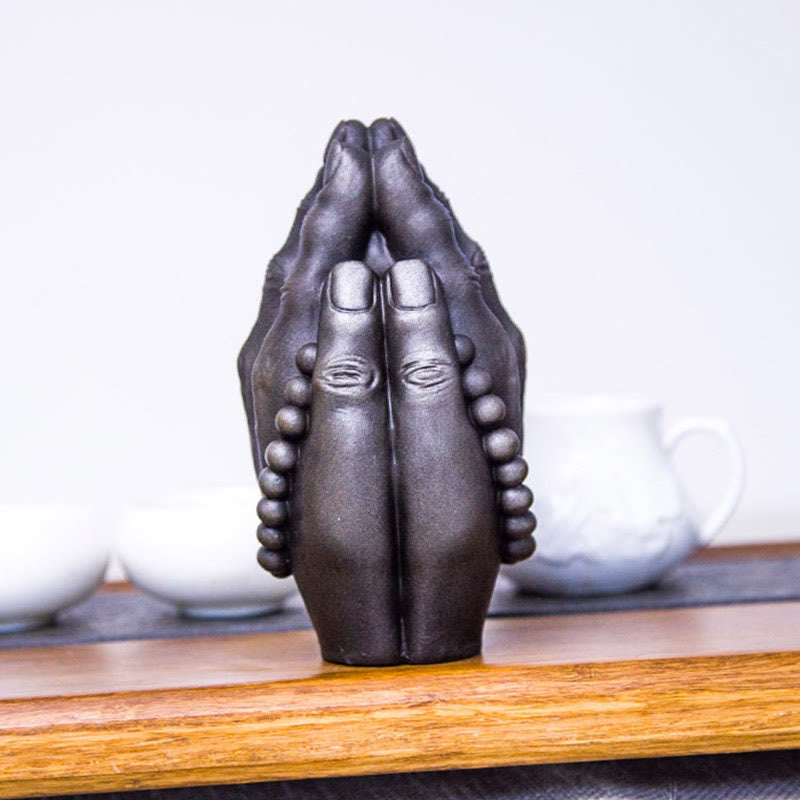 Buddha Hand Namaste Statue – iron powder and resin texture showing speckled rust tone