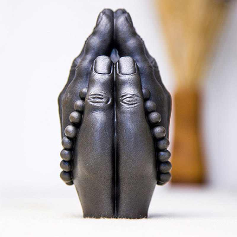 Buddha Hand Namaste Statue – comparison of two finish variations on wooden display tray