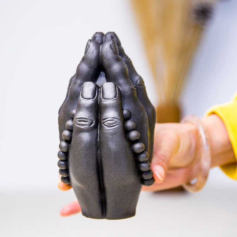 Buddha Hand Namaste Statue – prayer beads draped over hands for devotional altar scene