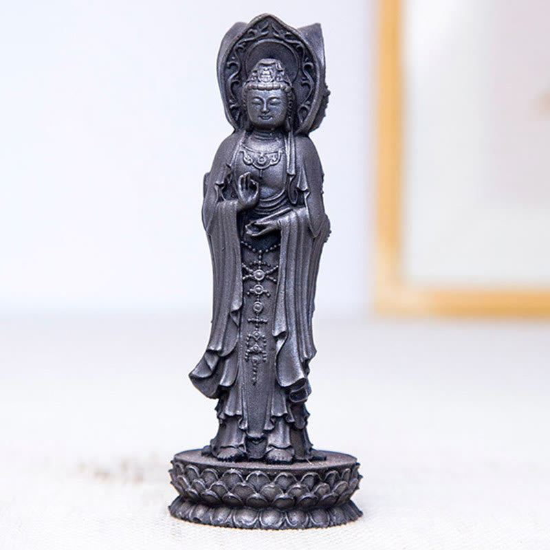 Three-Sided Kwan Yin Statue – statue held in hand showing compact portable desk size