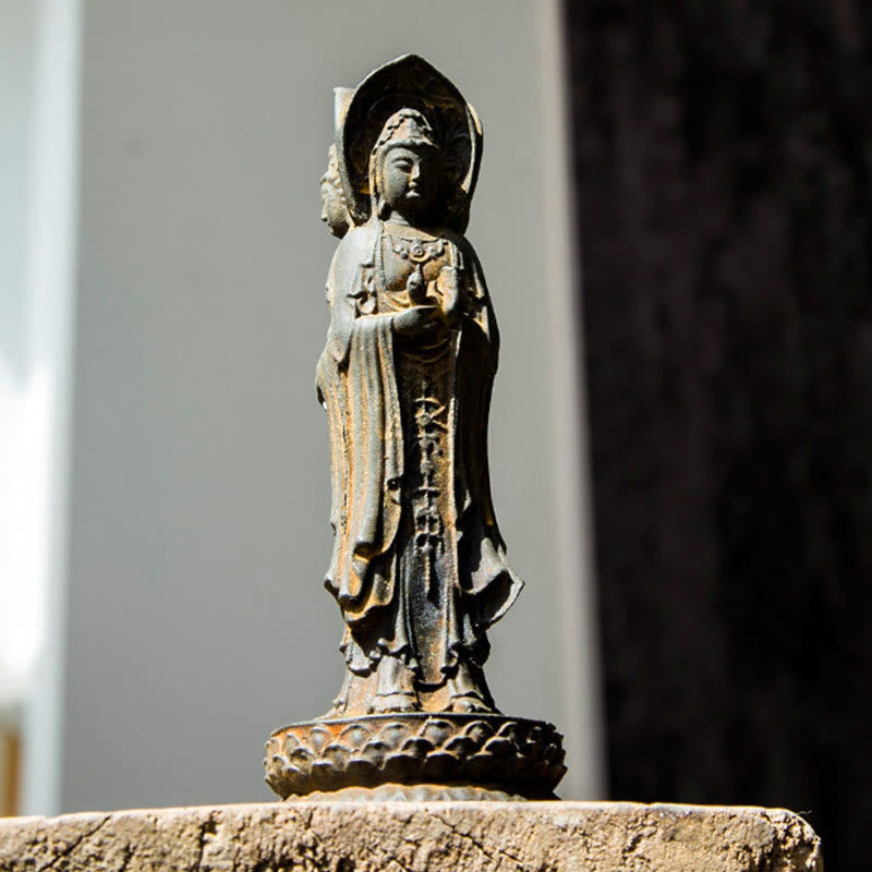Three-Sided Kwan Yin Statue – close-up of central face with crown and jeweled necklace