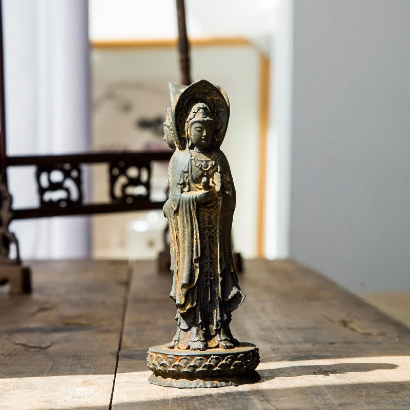 Three-Sided Kwan Yin Statue – left face of wisdom with serene contemplative expression