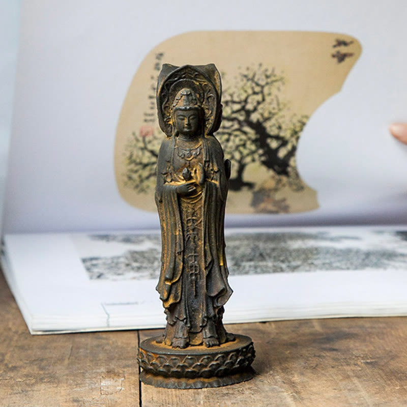 Three-Sided Kwan Yin Statue – full figure on wooden desk with ambient lamp and incense