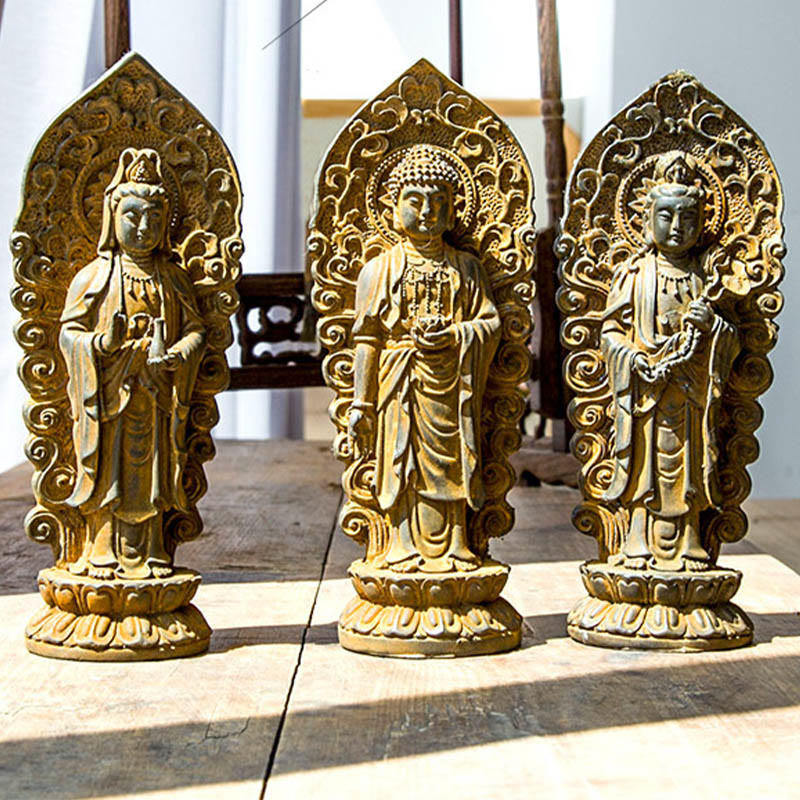 Amitabha Guanyin Trio Statue – statue trio in meditation room with candle ambient glow