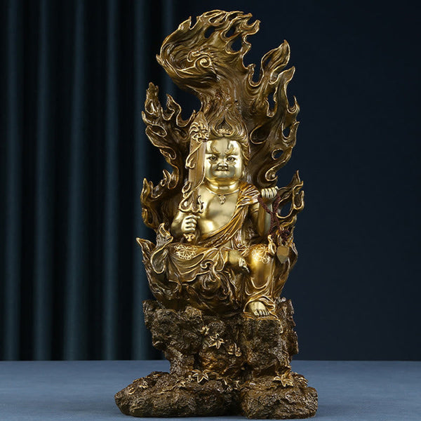 Acalanatha Buddha Statue – serene copper deity in meditation pose on carved wooden altar