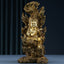 Acalanatha Buddha Statue – serene copper deity in meditation pose on carved wooden altar