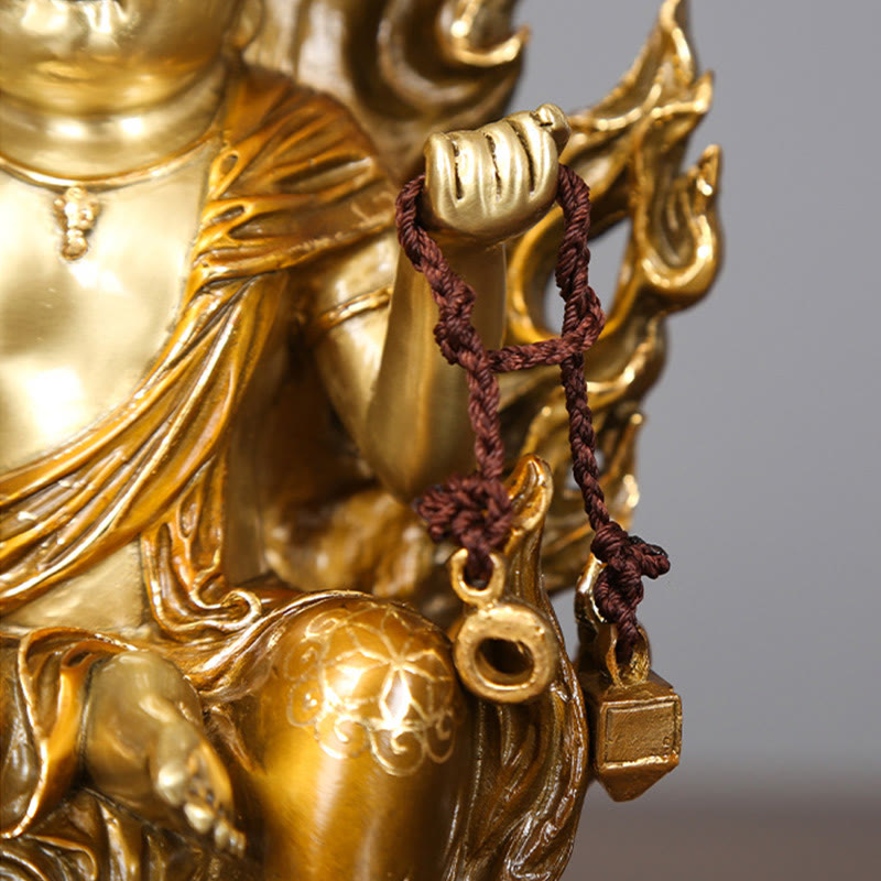Acalanatha Buddha Statue – full figure on wooden surface with warm ambient altar lighting