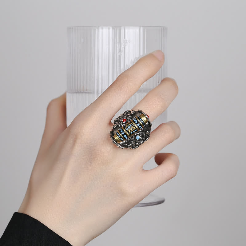 Garuda Dzi Ring – Eye-pattern dzi spinner on oxidized silver band worn on hand, meditative