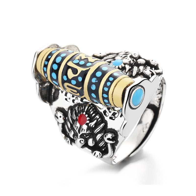 Garuda Dzi Ring – Gold mantra barrel with turquoise accents and red-eyed lion heads on silver band, fierce