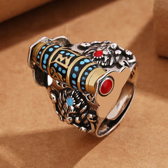 Garuda Dzi Ring – Black spinner with turquoise dots and red heart cabochon between beast carvings, bold