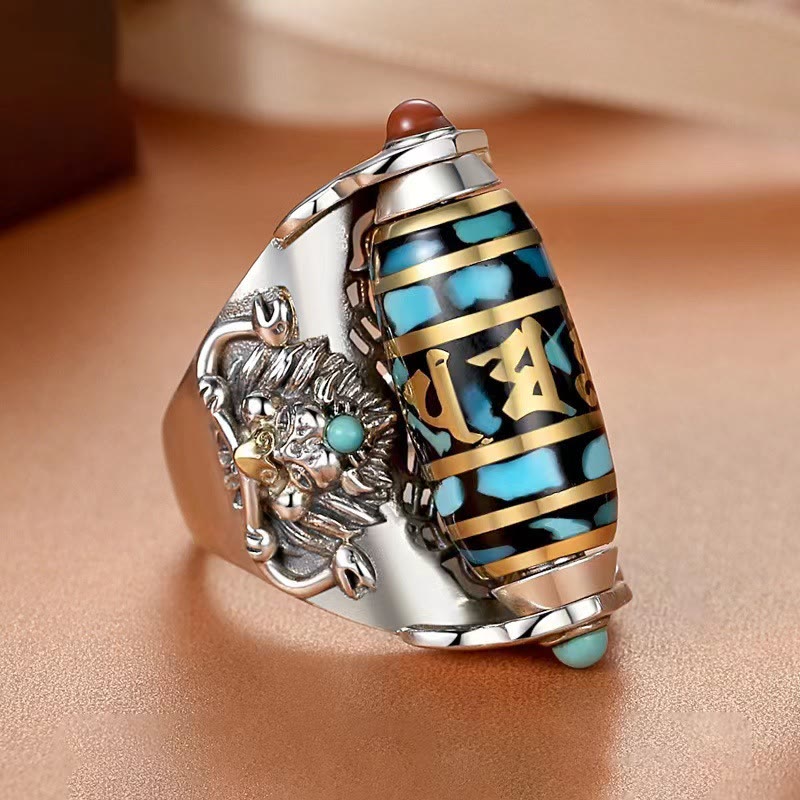 Garuda Dzi Ring – Turquoise-inlaid spinning bead with gold mantra script and snow lion guardian, empowered