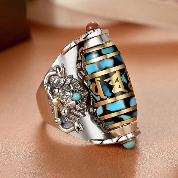 Garuda Dzi Ring – Turquoise-inlaid spinning bead with gold mantra script and snow lion guardian, empowered
