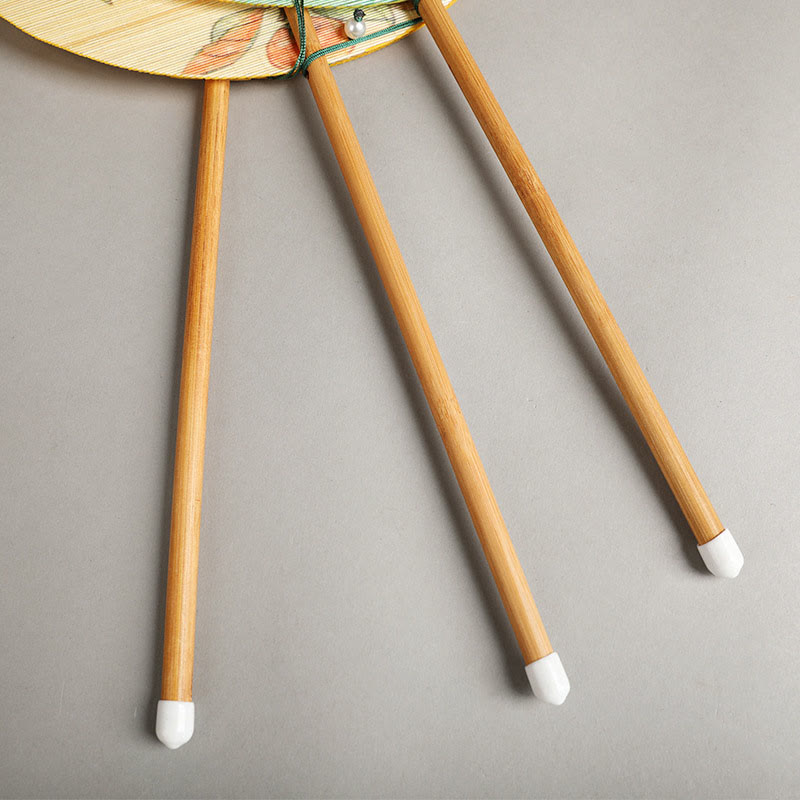 Chinese Koi Fish Lotus Fan - close-up of bamboo support sticks with white tips and floral artwork, green cord
