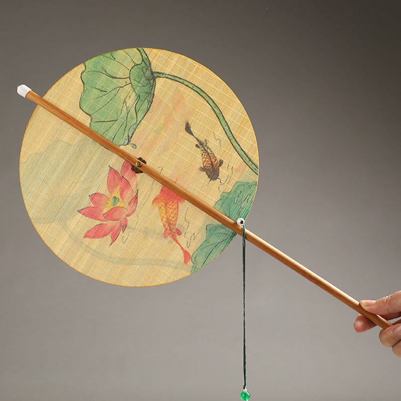 Chinese Koi Fish Lotus Fan - koi carp and pink lotus artwork on round silk fan, bamboo handle with jade tassel