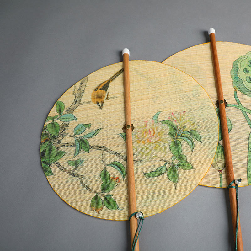 Chinese Koi Fish Lotus Fan - two overlapping round fans with bird, flower and lotus pod artwork on woven bamboo