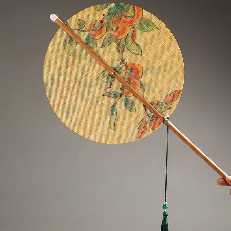 Chinese Koi Fish Lotus Fan - round fan with traditional botanical painting, bamboo handle and emerald tassel detail