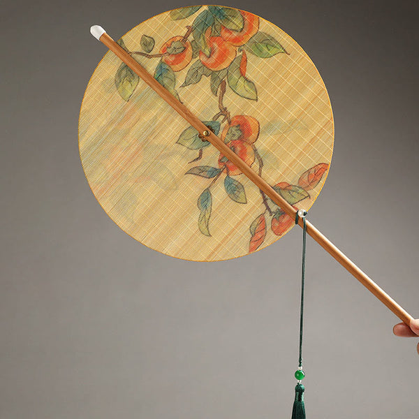Chinese Koi Fish Lotus Fan - round fan with traditional botanical painting, bamboo handle and emerald tassel detail