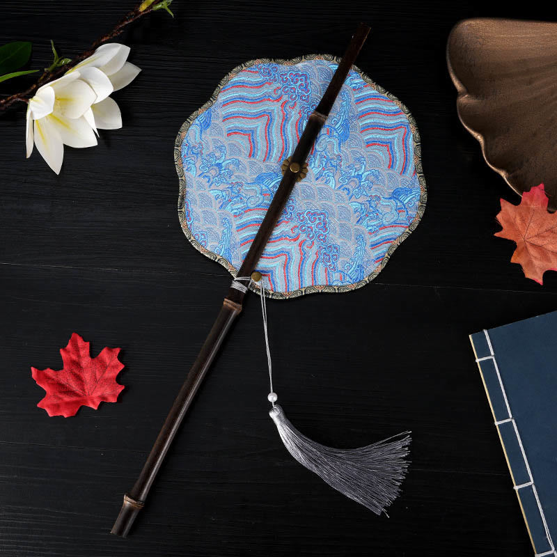 Blue Brocade Scalloped Fan – Cloud wave pattern with gray tassel, folding fan