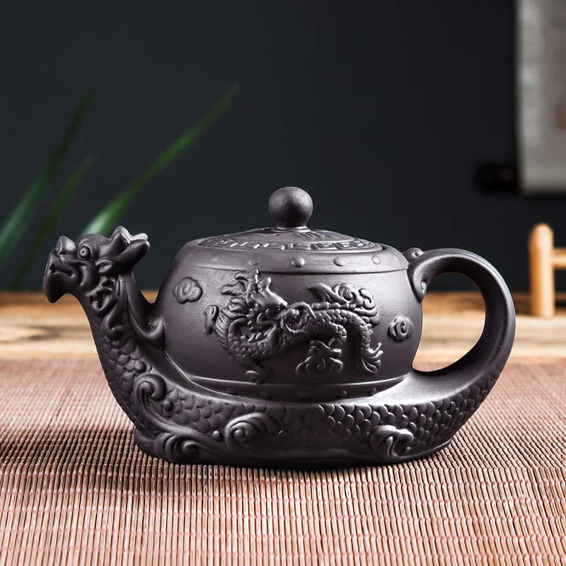 Vintage Dragon Auspicious Clouds Teapot – matte black dragon teapot with relief carving on woven mat, dark variant showcase