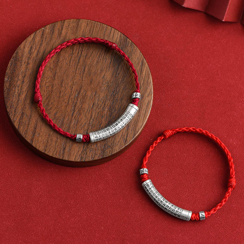 999 Silver Heart Sutra Bracelet – Two bracelets on red velvet stand, red and black cord with silver mantra beads