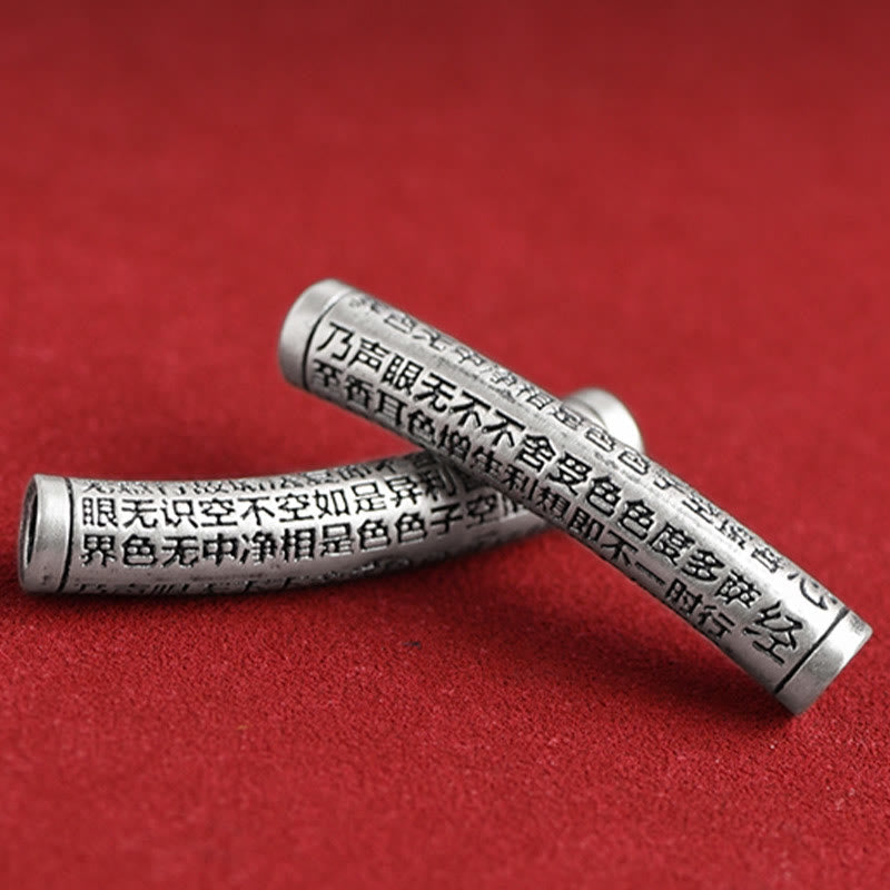 999 Silver Heart Sutra Bracelet – Two silver cylinders with Heart Sutra engraving detail, scripture charm close-up