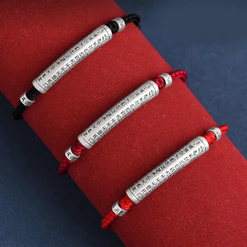 999 Silver Heart Sutra Bracelet – Three cord variants on red velvet stand, red and black with silver scripture beads