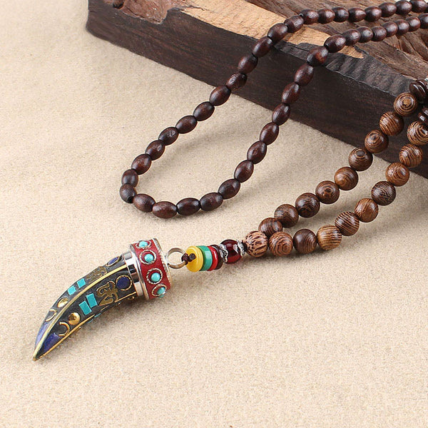 Wenge Wood Horn Pendant Necklace – Angled view of red-capped pendant with blue inlay, prayer necklace