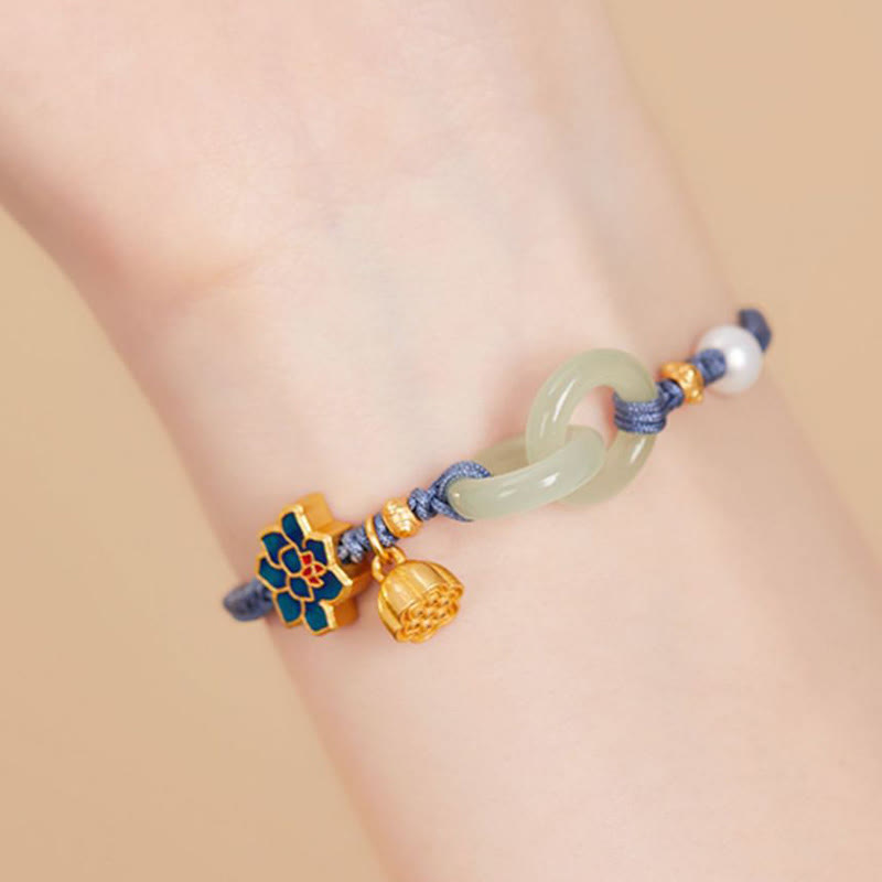 Hetian Jade Lotus Bracelet Worn – Blue cord with lotus pod on wrist, jade bracelet