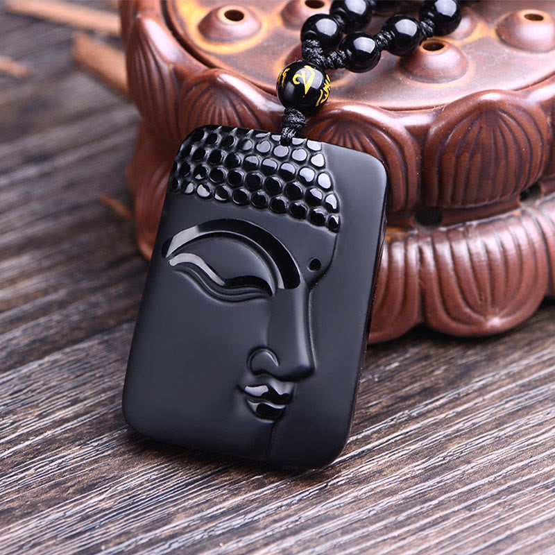 Natural Black Obsidian Buddha Prayer Necklace – Buddha head pendant close-up showing volcanic glass shine and carved face