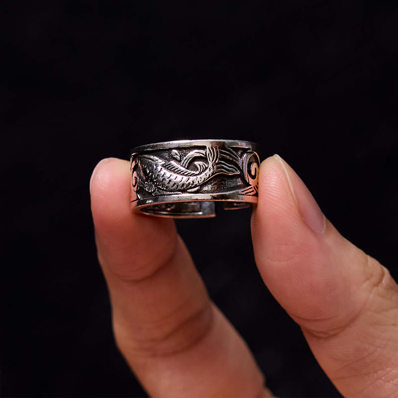 Koi Sutra Copper Ring – Worn on finger displaying koi relief and sutra carving, copper adjustable ring