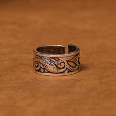 Koi Sutra Copper Ring – Close-up of Heart Sutra script engraving on warm copper surface, feng shui ring