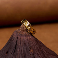 Golden Meditation Buddha Ring – shiny copper adjustable band close-up, buddha ring metal texture